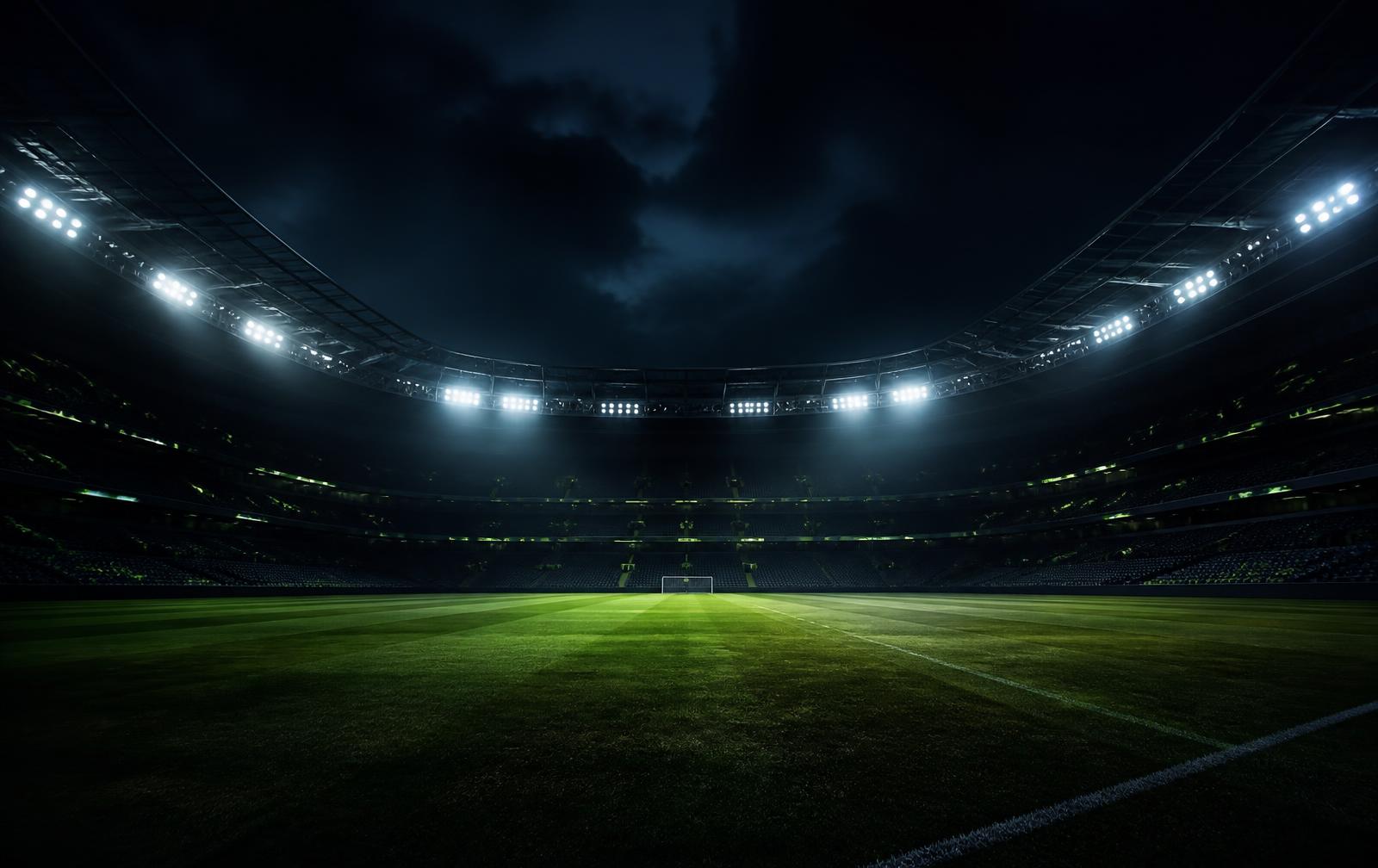 Floodlit stadium at night